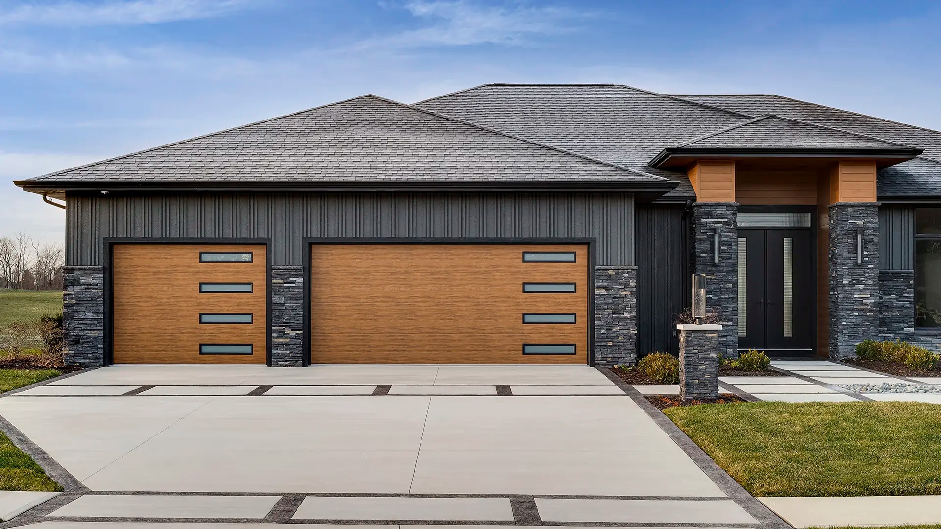 Modern home with custom wood garage doors